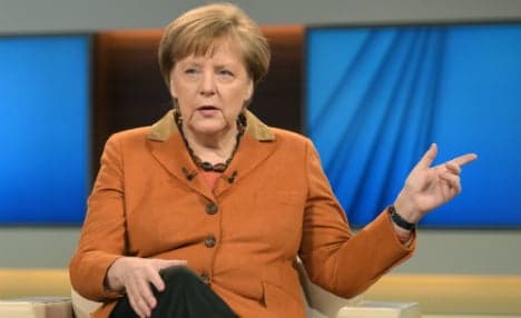 'I will do my damn duty' on refugees, says Merkel