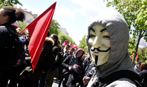 Who are the masked rioters causing havoc in France?