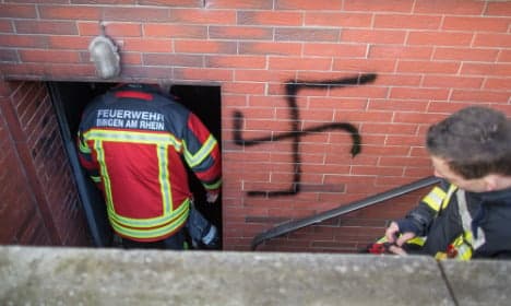 Refugee admits to swastika arson attack
