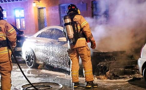 Copenhagen police arrest teen as car fires continue