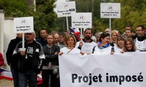 French villagers rally against migrant relocation plan