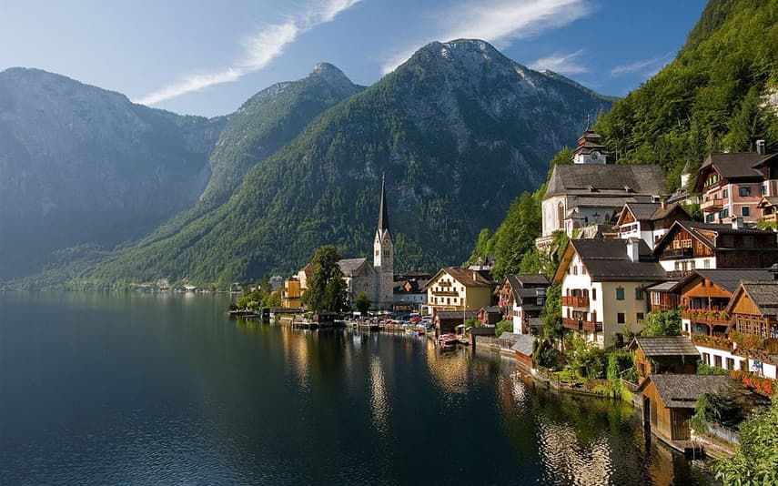 Bouncers guard Hallstatt's church doors during services to keep tourists away