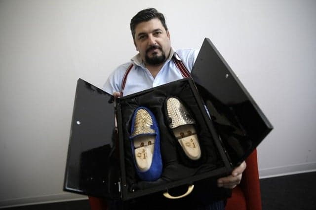 An Italian shoemaker has made the world's first 24-carat gold shoes