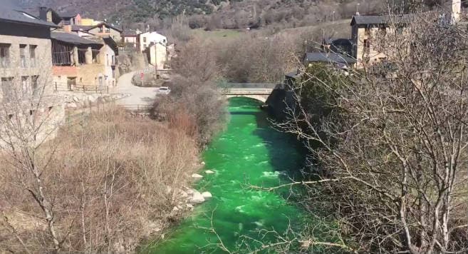 Alarm after river in Pyrenees turns fluorescent green