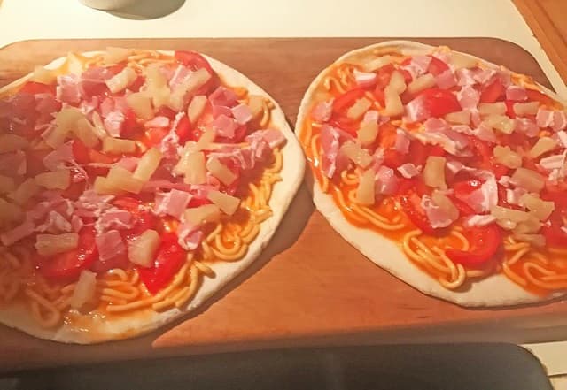 Italy's New Zealand embassy declares vendetta over PM's spaghetti pizza