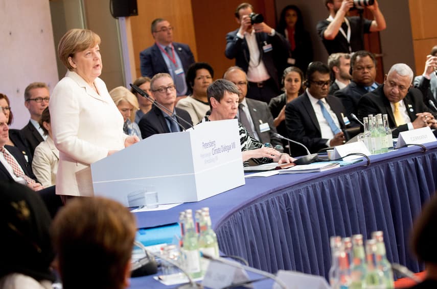 Merkel vows to convince climate change 'doubters'