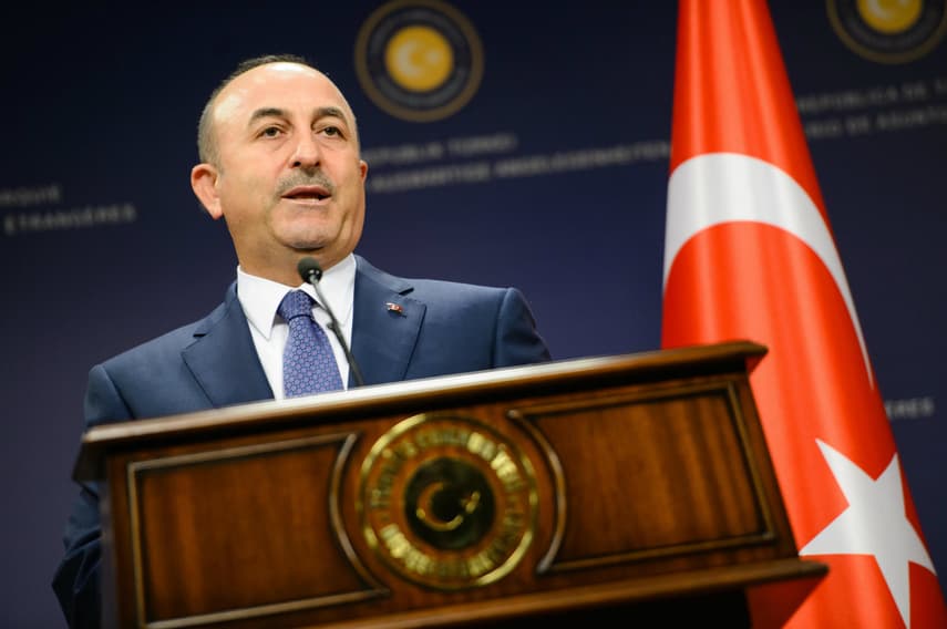 Turkish foreign minister defiant over arrested Germans