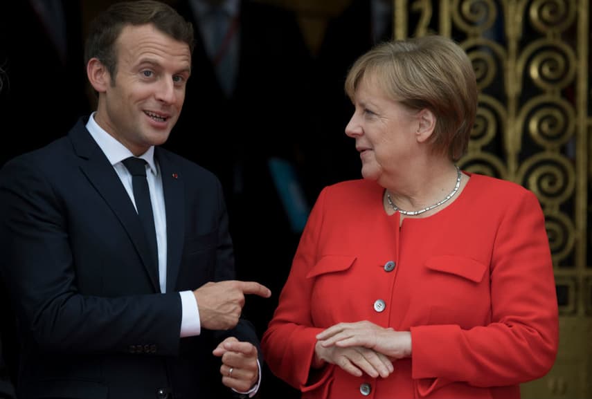 Macron urges Merkel to fight for EU reforms in Frankfurt