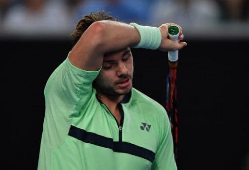 Wawrinka out of Australian Open while Federer marches on