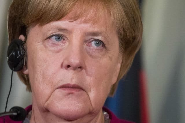 Merkel meets Macron halfway on eurozone reforms