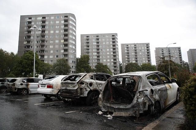 What's behind the car burnings in western Sweden?