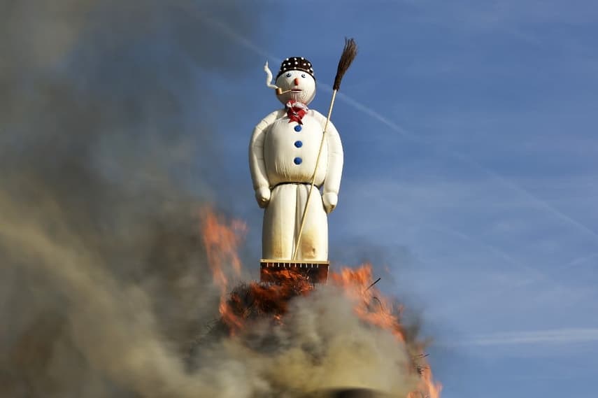 Why do people in Zurich burn a huge snowman every April?