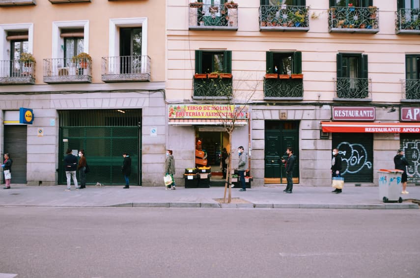 IN PICS: Madrid's hauntingly quiet streets and dystopian queues of shoppers