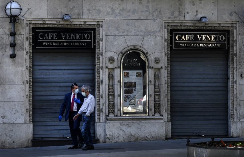 Italy's shops and restaurants struggle to reopen with new rules and few customers