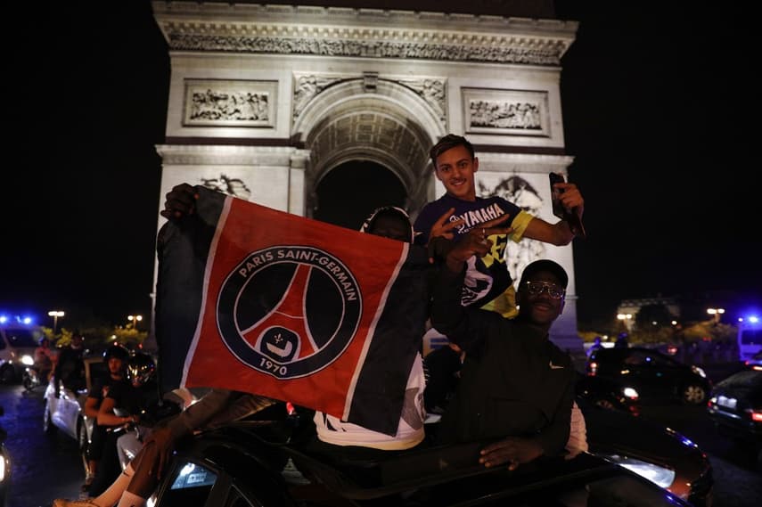 French police arrest 36 after crowds flock to Champs-Elysées following PSG win