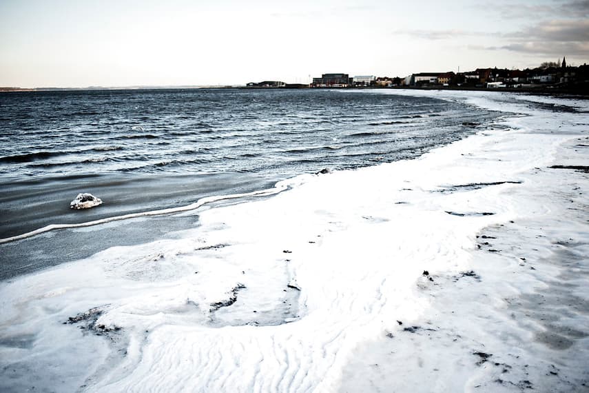 Denmark fines 17 winter bathers for gathering in frozen lake