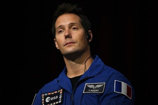 French astronaut returns safely to Earth