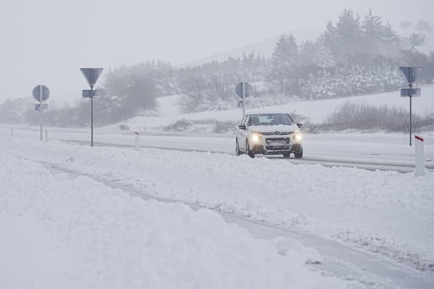 How are snowstorms affecting travel in Denmark on Tuesday?