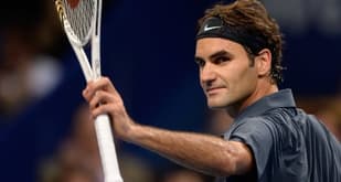 Federer reaches quarters in hometown event