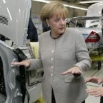 Merkel warns of hard economic times ahead