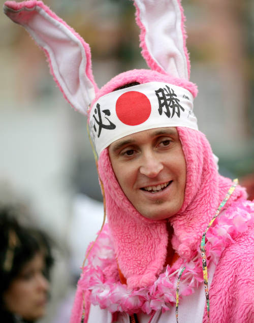 A reveler celebrates in bunny costume at the Heumarkt. Photo: DPA