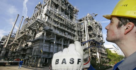 BASF suspends work and cuts profit target