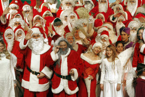 Lots of jolly St. Nicks meet, chanting Christmas Carols together to get themselves in the spirit.Photo: DPA