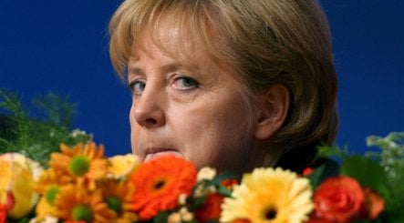 Merkel tries to snuff out criticism on economy