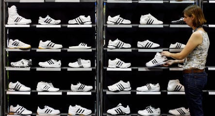 Adidas profit plummets in second quarter