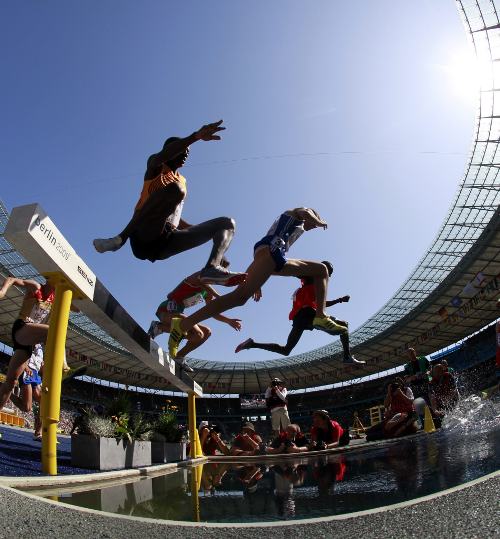 Runners clear the steeple during the 3000m Steeplechase heat at the 12th IAAF World Championships in Athletics, Berlin.Photo: DPA