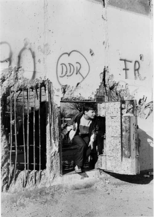 Stepping through the wall from west to east. Berlin, March 1990.Photo: Gabriele Greany