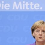 Merkel brushes aside campaign critics