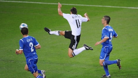 Two goals by Klose keep Germany headed for World Cup