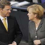 Merkel starts contentious coalition talks with FDP