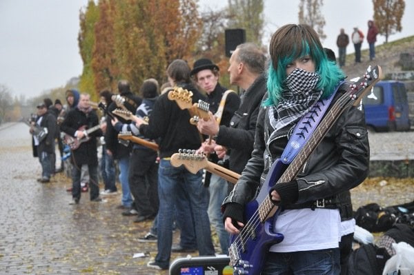 Berlin’s Mauerpark, which is the former Wall death strip, hosted almost 200 guitarists and bassists for a memorial project, titled “The Berlin Wall of Sound.” Photo: Julia Lipkins
