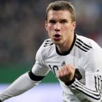 Podolski brace saves draw for Germany on emotional Enke night