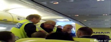 Boxers pin passenger in mid-air scare
