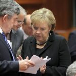 Merkel defies Europe over bank-bonus tax