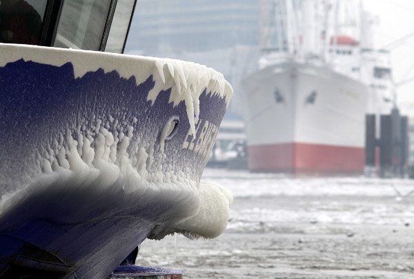 The prow of a harbour launch is frozen over with a thick layer of ice at St. Pauli Landungsbrücken in Hamburg Harbour on January 24, 2010.Photo: DPA