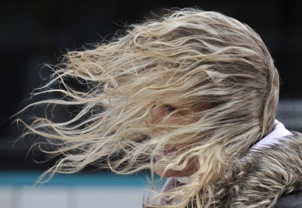 A woman in Frankfurt getting a bit windblown as the storm hit on Sunday.  Photo: DPA