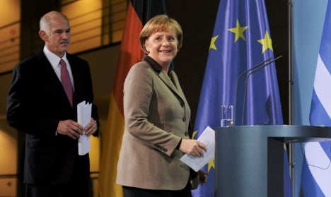Merkel pledges eurozone stability to Greece