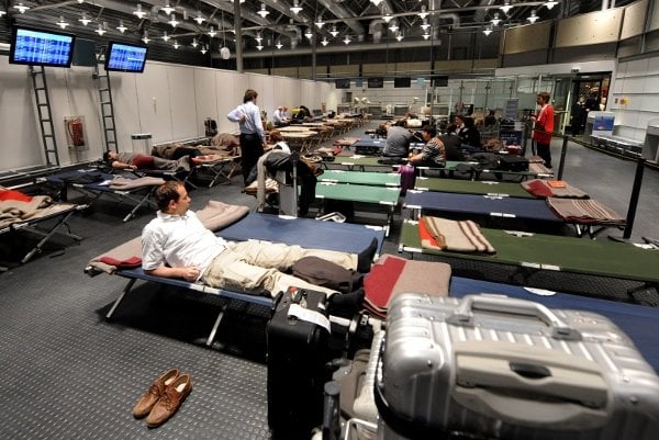 Stranded airline customers rest in Munich over the weekend. Photo: DPA