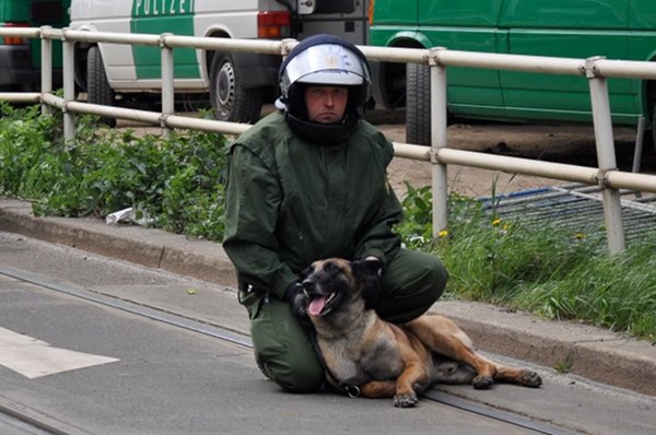 A policeman calmed his dog behind the barricade lines.Photo: Julia Lipkins