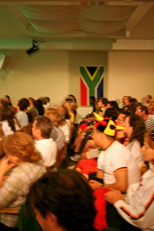 Goethe-Institut in Stockholm, Wednesday, July 7<br>A South African flag hangs on the wall as German fans proudly wear their jerseys to cheer on their teamPhoto: Emy Gelb