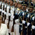 Merkel pushes China to open its markets