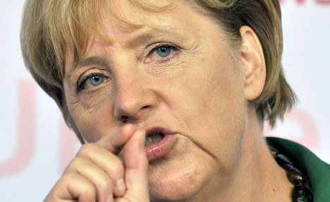 Merkel's cabinet backs tough austerity package