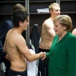 Merkel tries to calm locker room visit hubbub