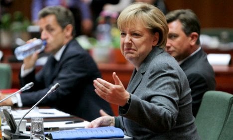 Merkel rams through EU financial crisis reforms