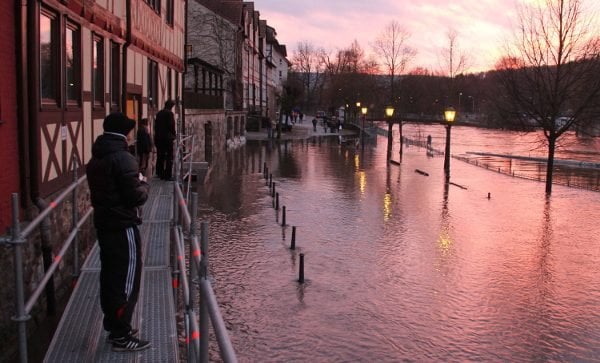 Residents survey the flooding at Hannoversch Münden in Lower Saxony where the Weser River starts.Photo: DPA