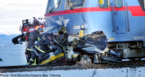 Two dead after Swedish train crushes taxi